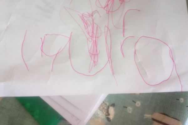 Laura learning to write her name